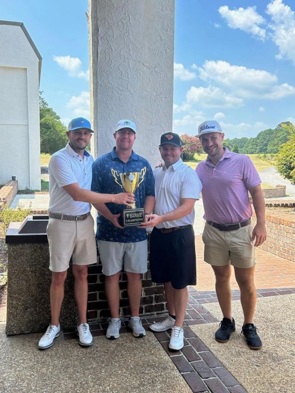Champions holding the Scramble for Daniel trophy